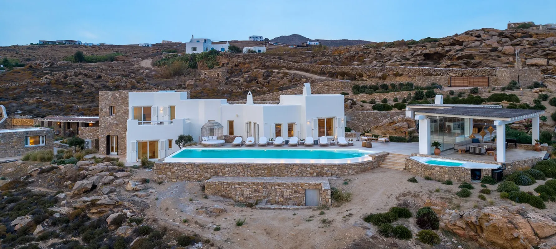 Exterior shot of Villa Olea and pool, Mykonos villa, available to rent with Bluemoon